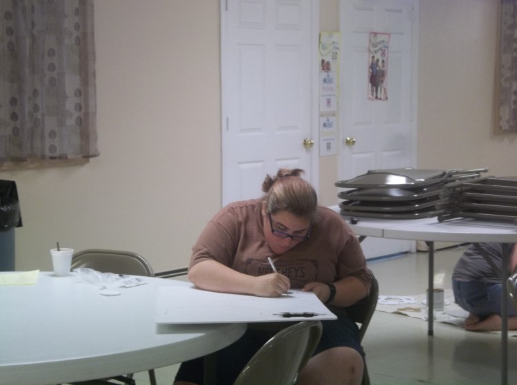 And here is my other daughter, Amanda, helping Melanie with her current art project.