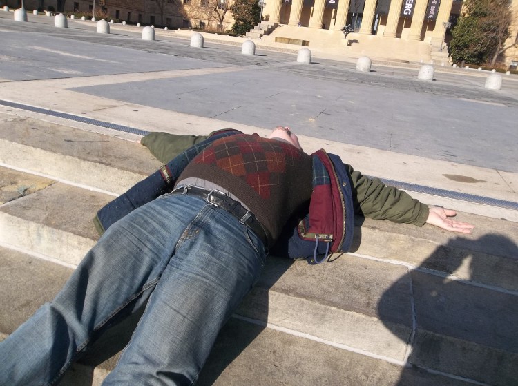 Me reclining after walking up the "Rocky" stairs at the Philadelphia Art Museum.